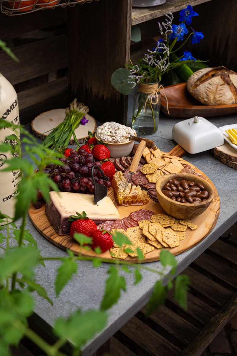 A cheese and charcuterie board set out for sharing.